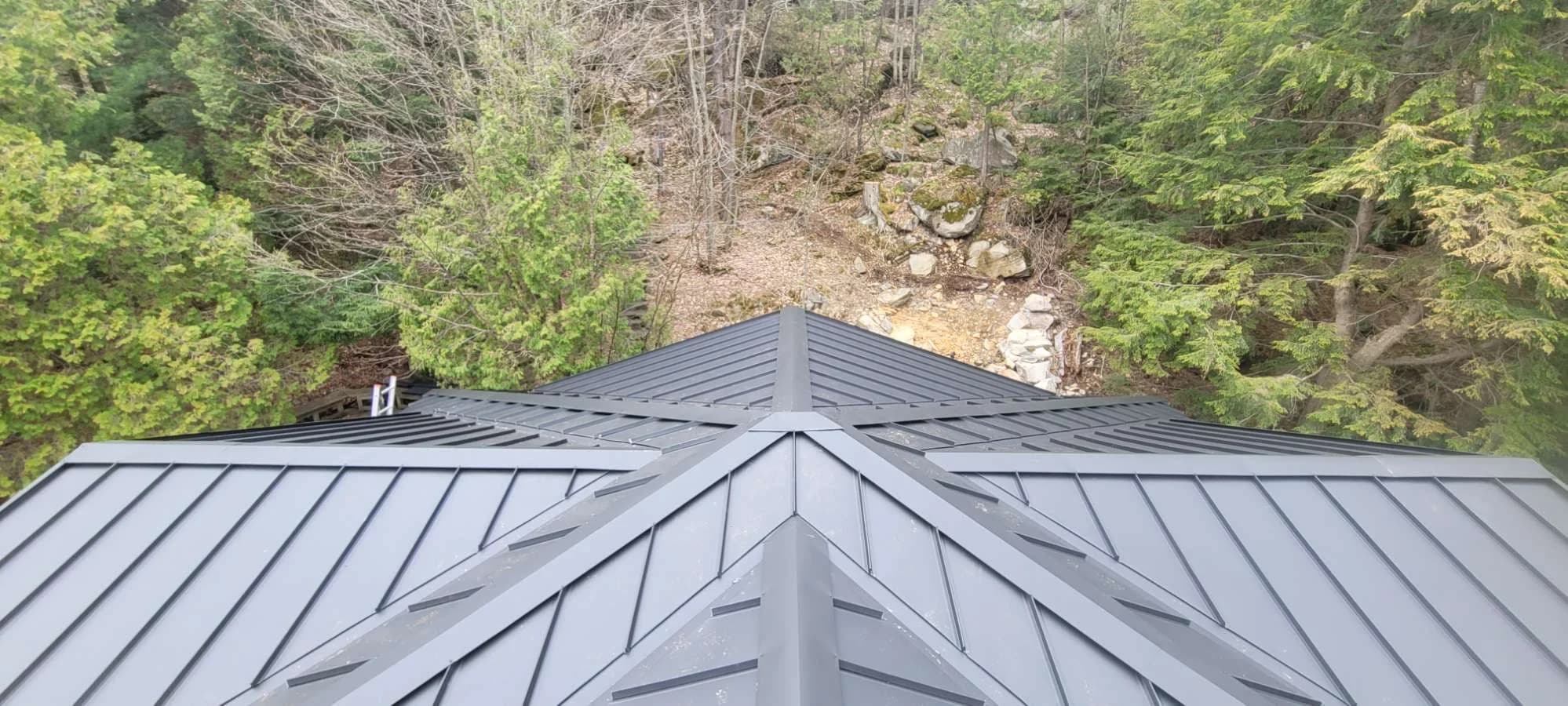 Overhead view of intersecting standing seam roof planes
