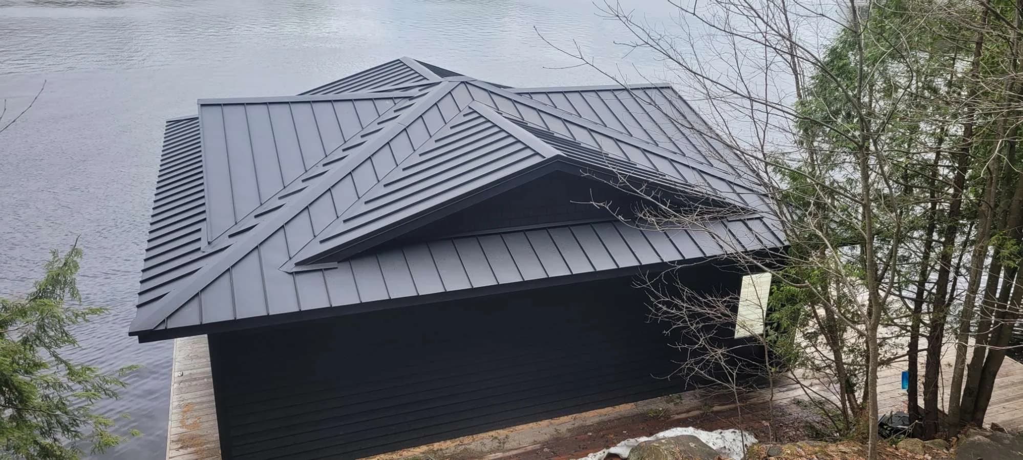 Dark metal roof on a boathouse beside the lake