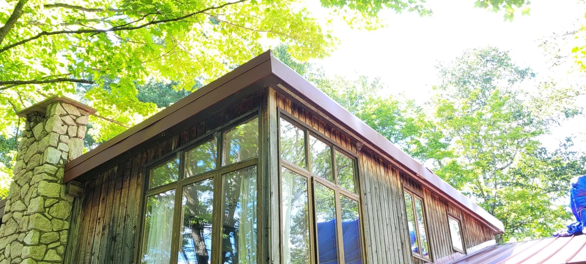 Finished roof edge above timber architecture and large windows