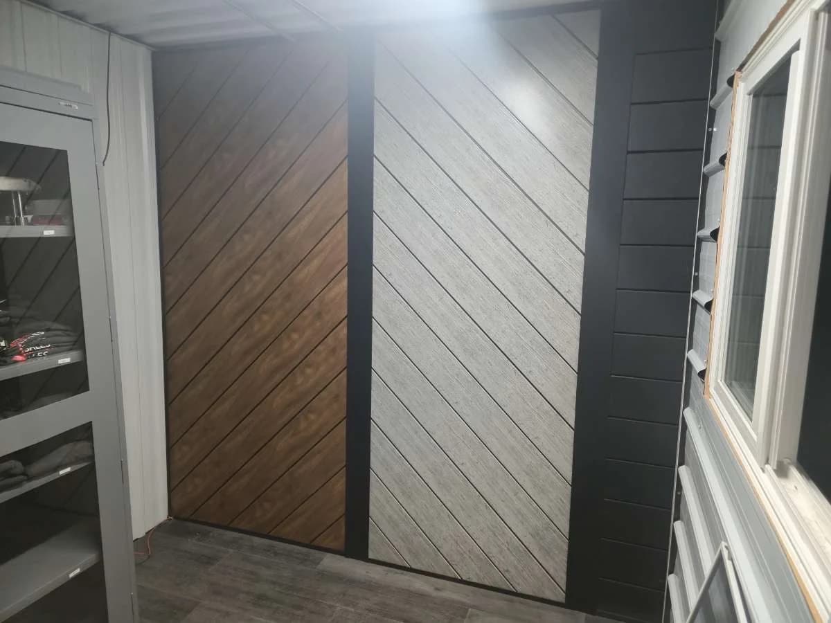 Angled metal siding and trim beside an exterior window
